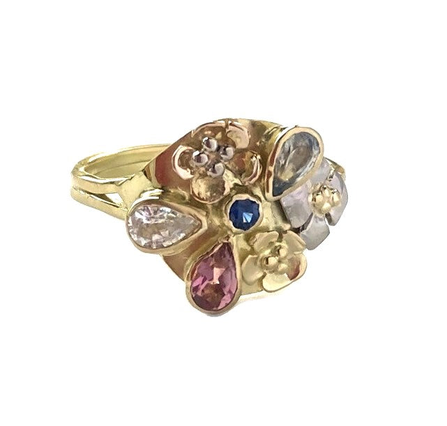 artisan floral sapphire cocktail ring in 18ct yellow gold, on white background