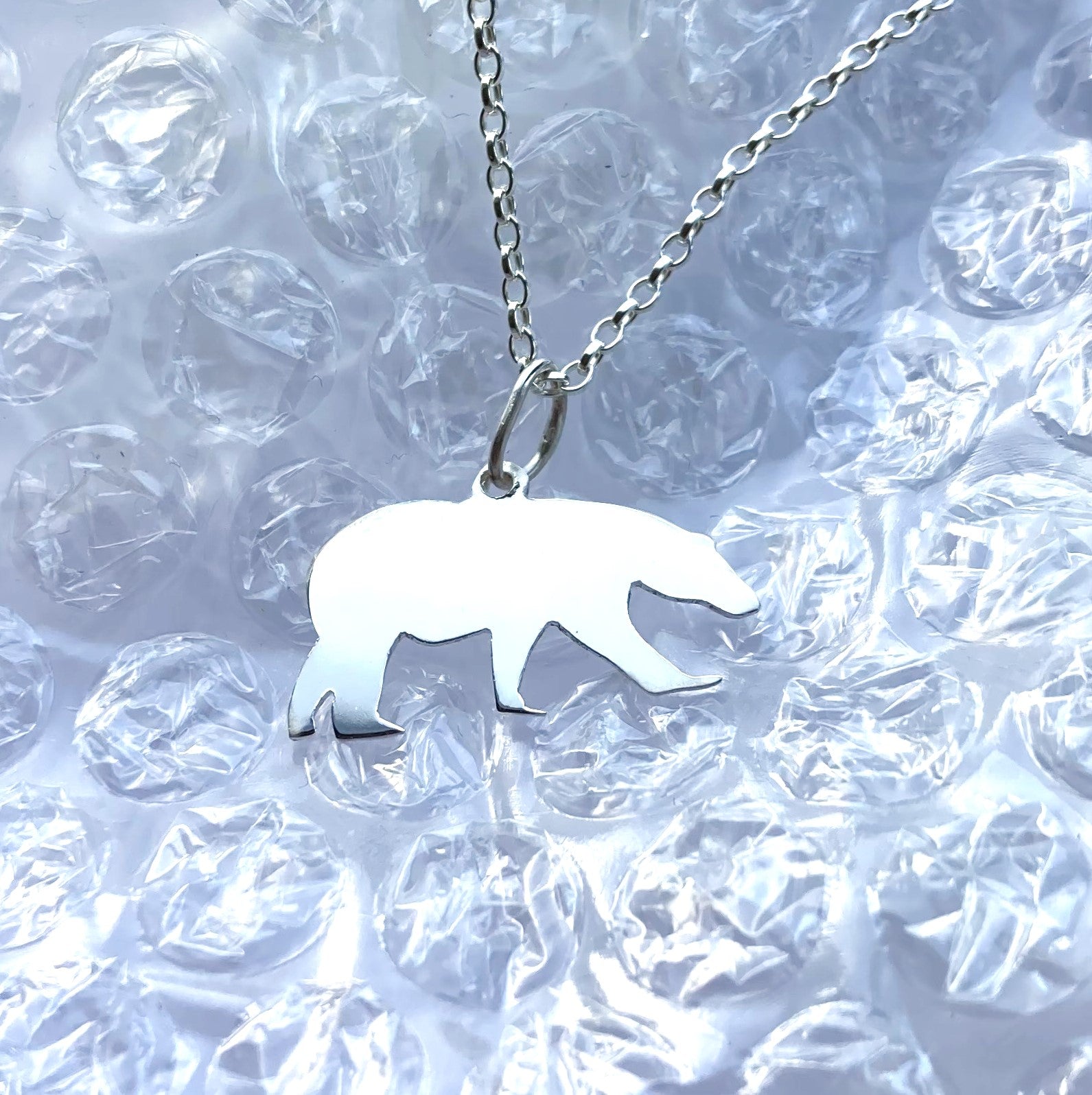 Bubble outlets silver bear pendant