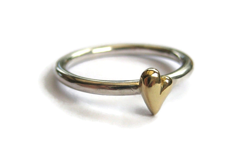 solid gold heart on silver halo ring, on white background