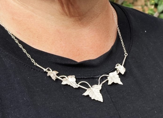 silver ivy leaf necklet worn on black t-shirt