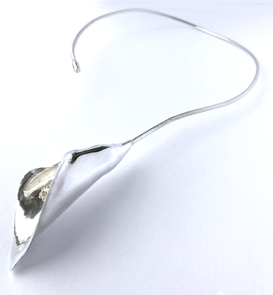 cala lily hand forged sterling silver statement torque necklace by Kim Styles Jewellery 0n white background