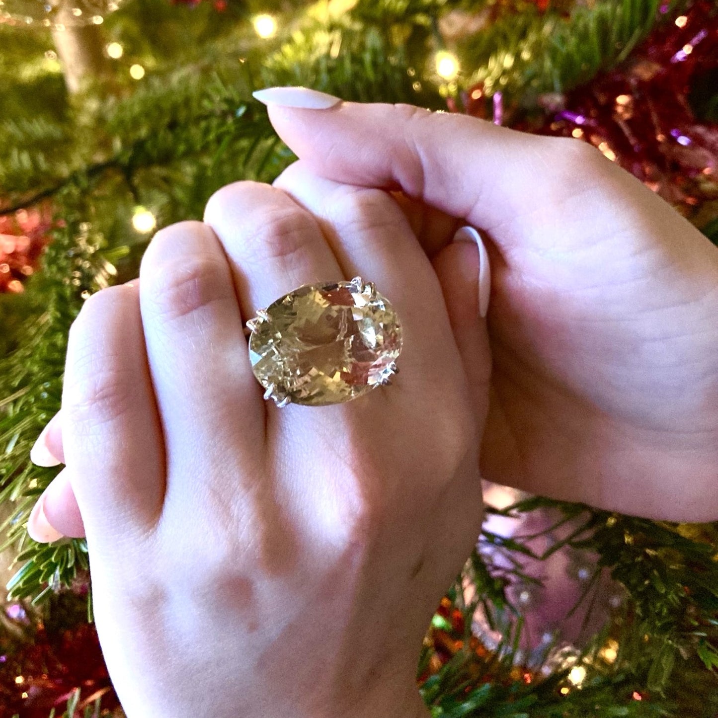 very large citrine gemstone cocktail ring, on ladies hands