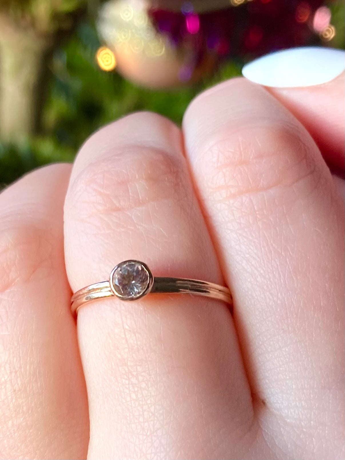 pink morganite gemstone ring set in rose gold twin shank ring, on fingers