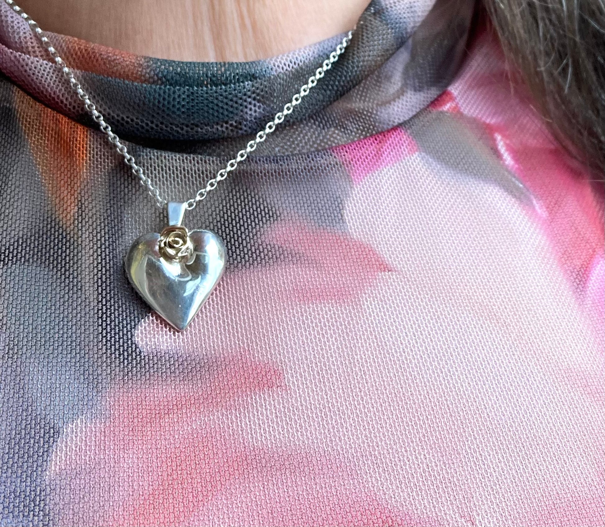 valentines gift silver heart with gold rose worn on colourful dress