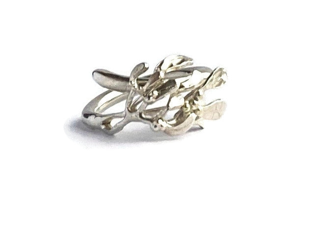 Mistletoe cluster ring hand forged in sterling silver, on white background