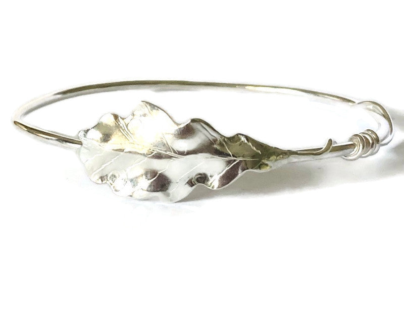 hand forged textured oak leaf bangle on white background