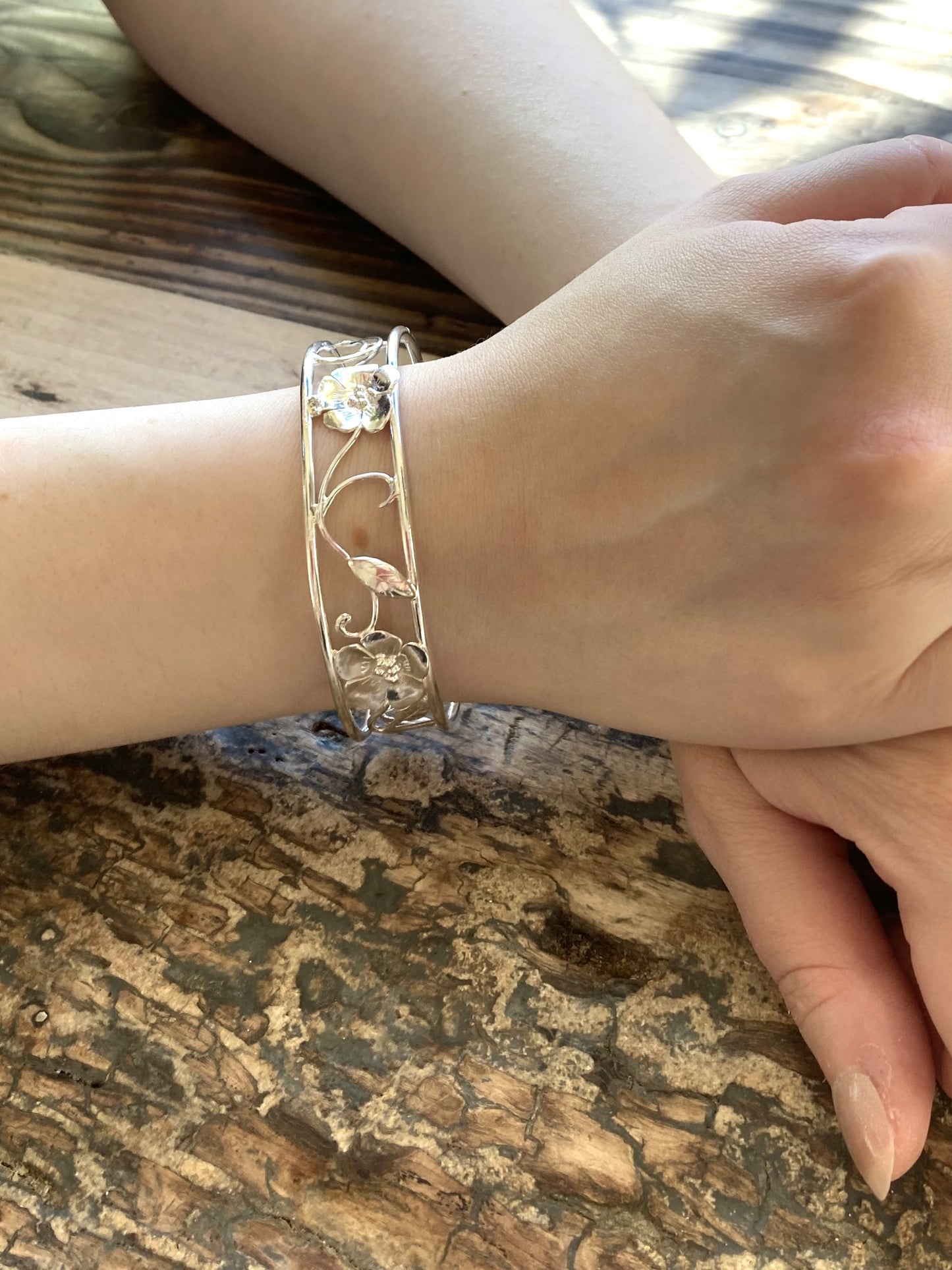 ornate floral openwork bangle, on ladies hands